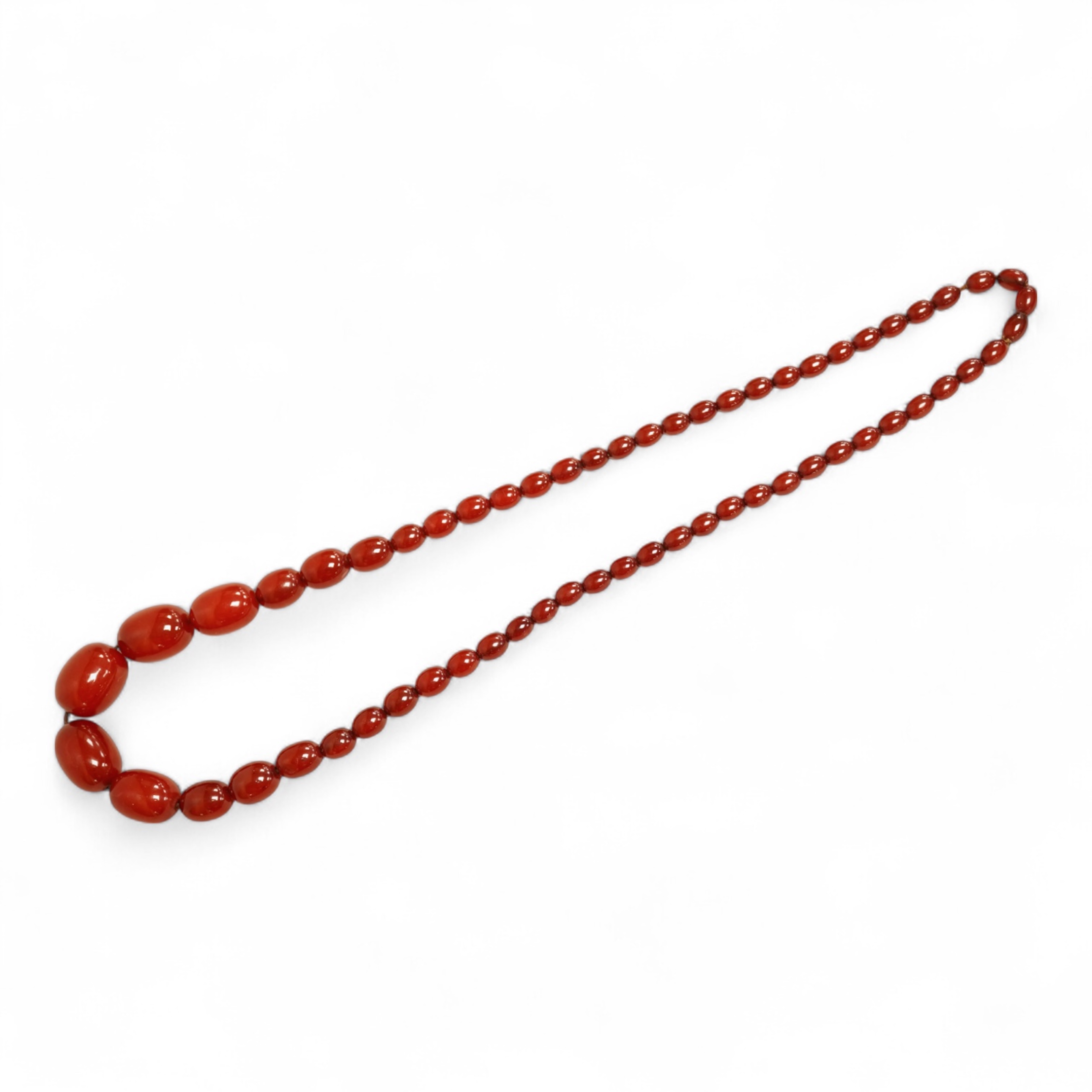 A single strand graduated simulated cherry amber bead necklace, 76cm, gross weight 75 grams.